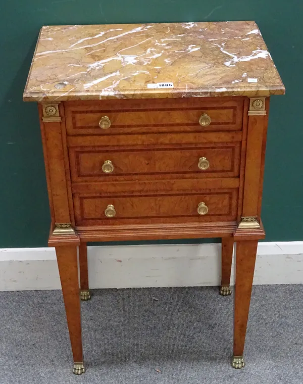 A Louis XVI style petite commode, the marble top over a gilt metal mounted tulipwood inlaid pollard oak base, with single drawer over cupboard, on tap