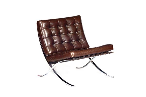 After Ludwig Mies van der Rohe; a Barcelona chair, with brown leather upholstery, 75cm wide x 78cm high.  Illustrated