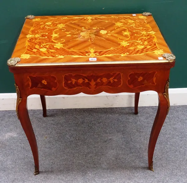 A Louis XV style French gilt metal mounted marquetry inlaid folding card table, circa 1900, 75cm wide x 75cm high x 59cm deep.