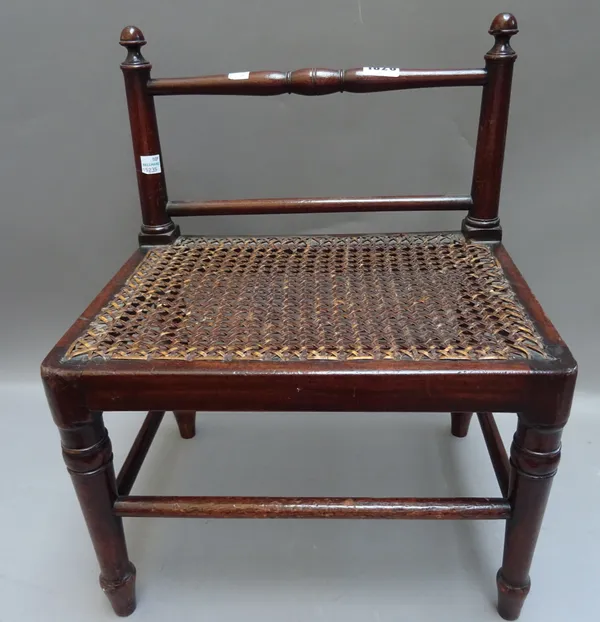 A Regency mahogany and cane footstool on turned supports, 36cm wide x 44cm high x 26cm deep, together with a 19th century mahogany clock bracket, 32cm