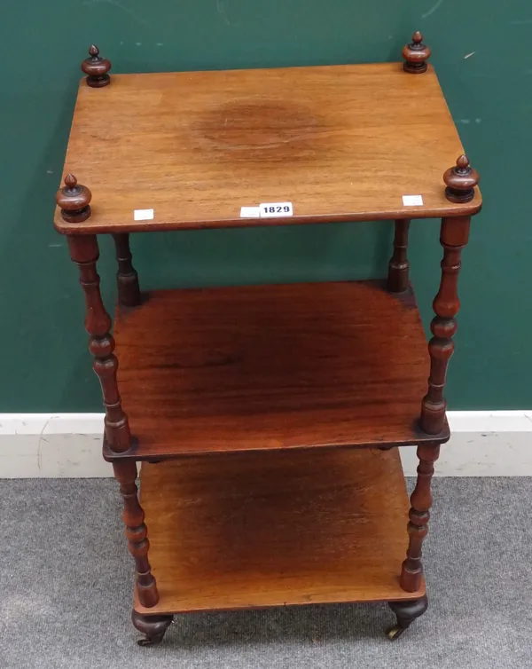 A Victorian rosewood three tier whatnot, on turned supports, 42cm wide x 77cm high x 32cm deep.