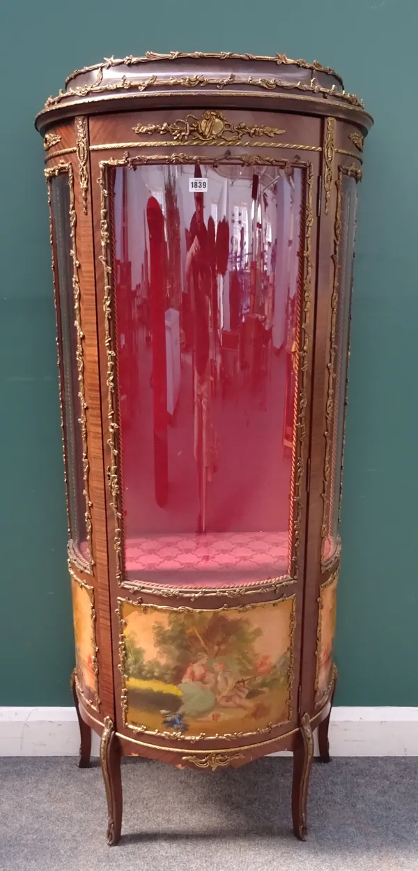 An early 20th century gilt metal mounted mahogany vitrine, with a trio of Vernis Martin style panels, on shallow sabre supports, 70cm wide x 165cm hig