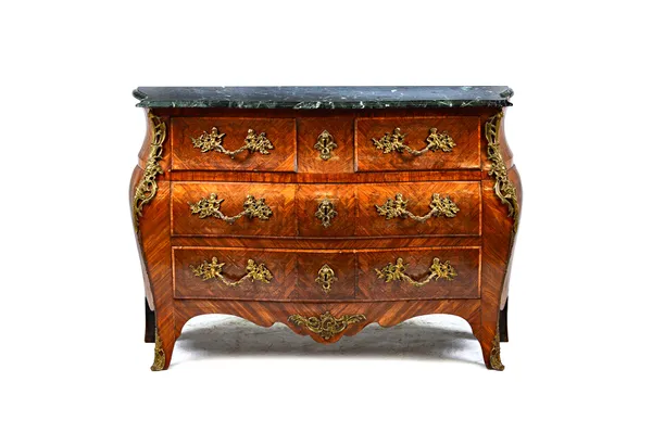 A Louis XV style gilt metal mounted parquetry inlaid Kingwood commode, the serpentine marble top over a bombé base of two short and three long drawers