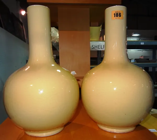 A pair of Chinese yellow glazed baluster shaped vases, later converted to lamps with remnants of seal stamp to base, (a.f), (2).  C4