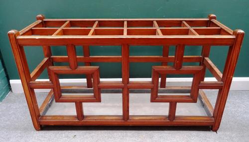 A large pitch pine twelve division stick stand, with open lattice sides 143cm wide x 80cm high x 48cm deep.
