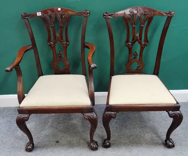 A set of twelve George III style mahogany dining chairs, with pierced splat on claw and ball feet, to include a pair of carvers, (12)