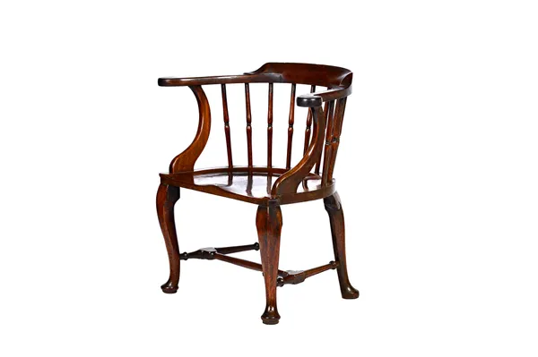 A George III mahogany low bow back Windsor chair, with waisted turned spindles and dished saddle seat with extended thumb moulded corners, on four cab
