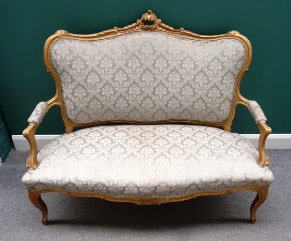 A Louis XV style seven piece salon suite, to comprise; an open arm sofa 135cm wide x 109cm high, a pair of open armchairs 66cm wide x 99cm high, and f