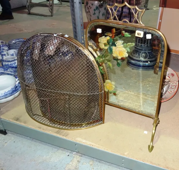 A mirror backed rectangular brass fire screen, 65cm high, and two brass and wire mesh fire guards of domed form, (3).  S2B
