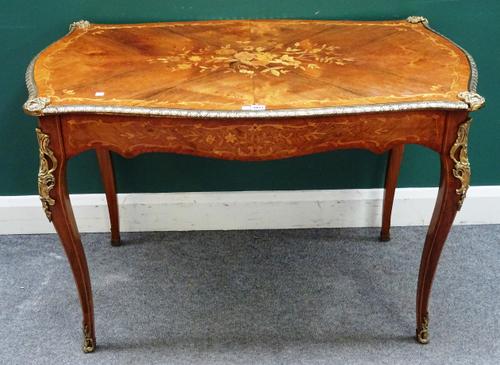 A French Louis XV style gilt metal mounted Kingwood and marquetry inlaid serpentine shaped centre table, with single frieze drawer, 115cm wide x 69cm