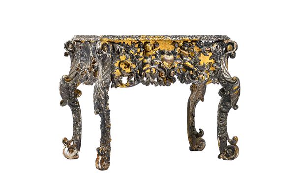 A late 17th century silvered and ebonised cabinet base, the frieze with pierced acanthus leaf decoration, centred by cherubs flanking a love heart, th