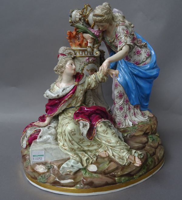 A Meissen group emblematic of `Peace', late 19th century, after a model by C.G. Jeuchtzer, modelled as a fallen female figure wearing a crown, above h