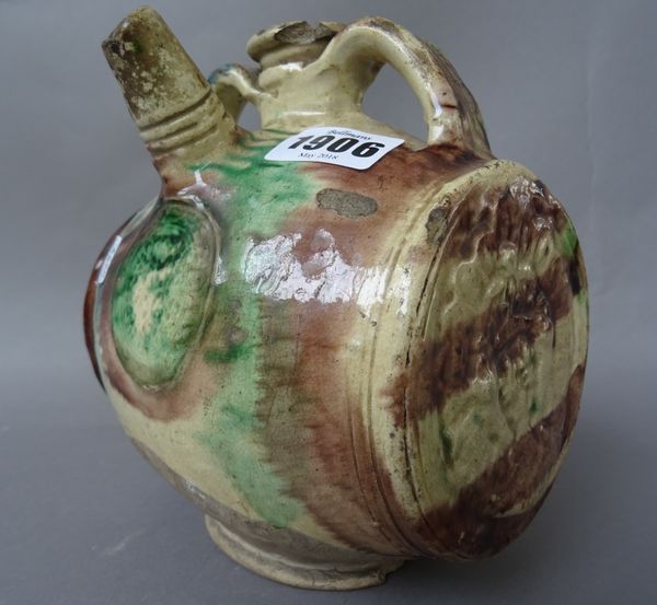 A French pottery costrel, possibly 17th century, of barrel form, indistinctly moulded at one end with a coat of arms, splashed in green, blue and mang