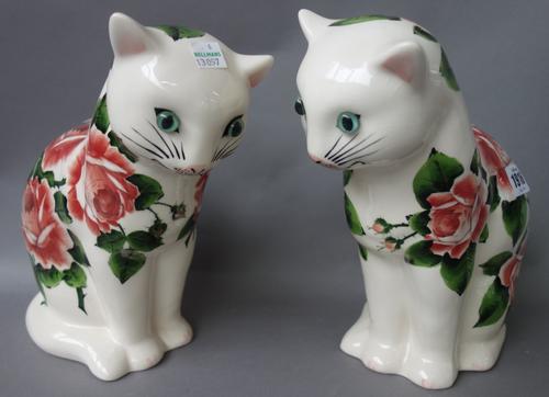 A pair of Griselda Hill pottery `Wemyss ware'  cats, late 20th century, decorated with roses, painted marks. 25.5cm high. (2)