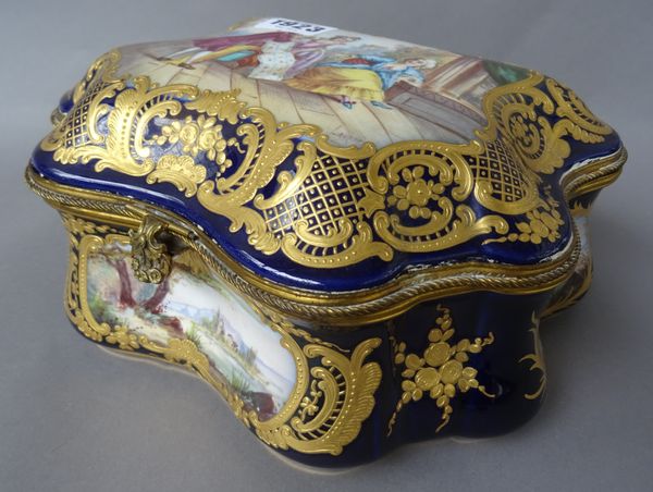 A Sevres style porcelain casket of bombé form, early 20th century, decorated with gallant, companions and landscape scenes against a foliate gilt and