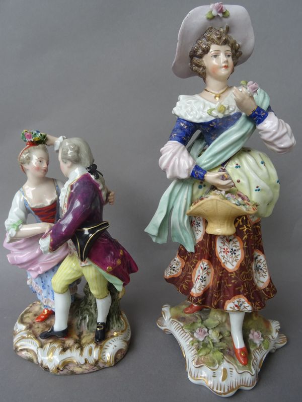 A Meissen porcelain figure group, late 19th/early 20th century,modelled as gallant and companion,  and a Sitzendorf porcelain figure modelled as a lad