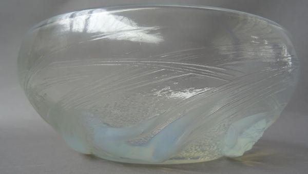 A Lalique 'Ondines' opalescent moulded glass bowl, detailed with six female nudes, wheel etched mark 'R. LALIQUE FRANCE'. 20cm diameter.   Illustrated