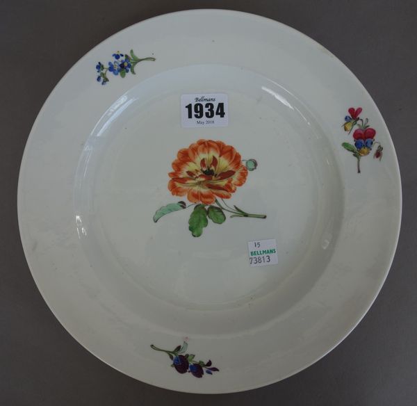 A Meissen porcelain plate, late 18th/19th century, painted with flowers against a white ground (23.5cm diameter), two later outside decorated Meissen