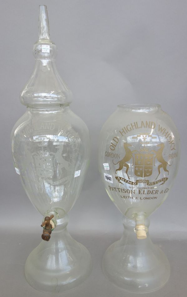 A large glass decanter and cover 'PATTISON ELDER & CO', gilt engraved crest, tap reservoir on a tapering circular foot (72cm high) and another matchin