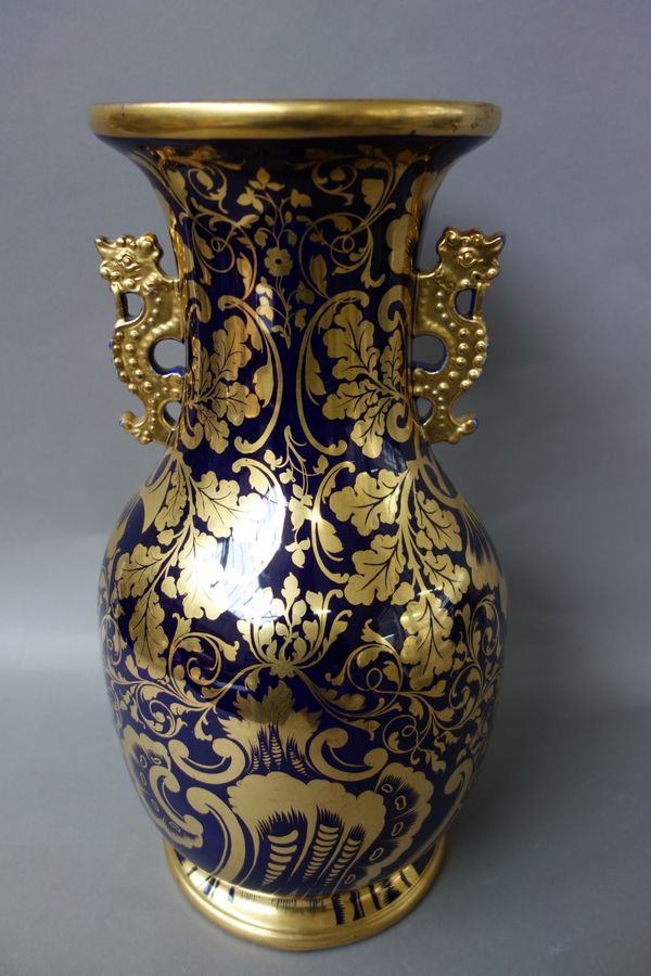 A Mason's Ironstone style blue-ground two-handled baluster vase, gilt with acorns and oak leaves and foliate scrolls against a deep blue ground, 42.5c