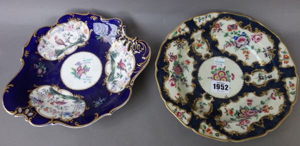 A Worcester porcelain cabinet plate, circa 1770, painted with flowers against a gilt cobalt blue ground (22.5cm diameter), a pair of English porcelain