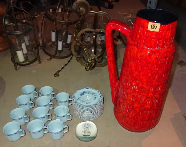 A large red and orange West German pottery jug, a Limoges part tea set and a glass paperweight, (qty).  S3B