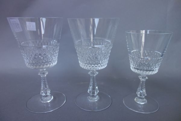 A part suite of Val St Lambert glass stemware, with moulded hobnail cut bowl and faceted tapering stem comprising; ten water glasses (17cm high) and f