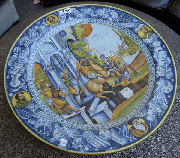 A modern Italian maiolica charger, of large proportions, decorated with an Italian mythological scene, within a wide border and yellow rim.