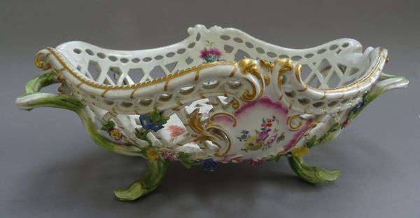 A Meissen porcelain two- handled pierced basket, circa 1760, of pierced oval form with naturalistic handles and applied foliate decoration, 34cm acros