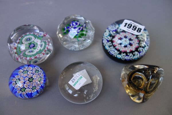 A group of six glass paperweights, 19th century and later, comprising; a late 19th century Baccarat concentric millefiori facet cut  weight, 6.5cm. di