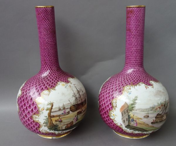 A pair of large German porcelain bottle vases,  late 19th/early 20th century, each painted with riverscapes against a gilt puce ground, mark to base,