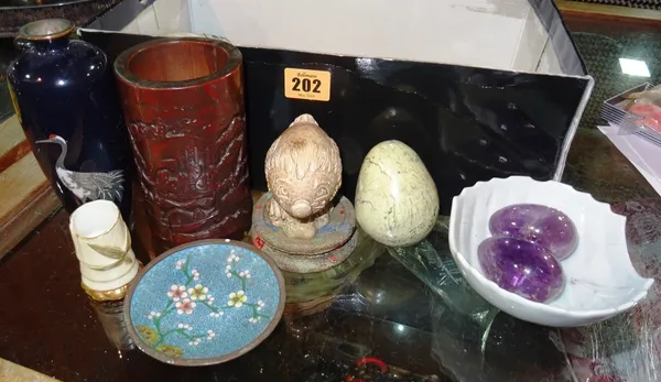 Asian collectables, including; a Cloisonné vase, a fan, carved items, hardstone eggs, embroidered panel, white glazed dish and sundry, (qty).  CAB