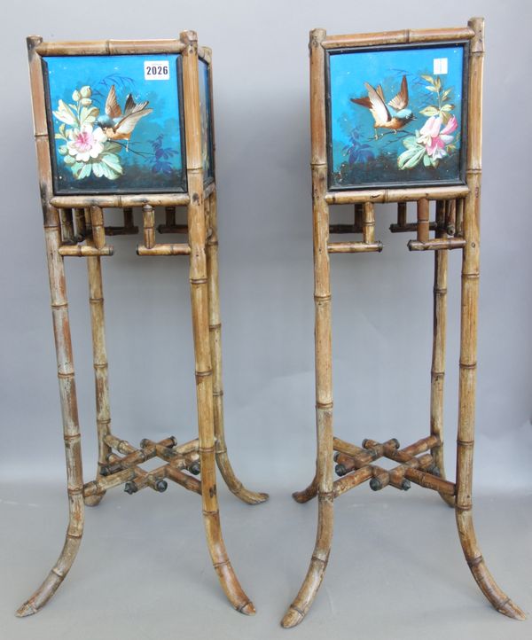 Eight Montreau pottery tiles, mounted as the top of a pair of Aesthetic period bamboo plant stands, the tiles decorated with birds and flowers, agains