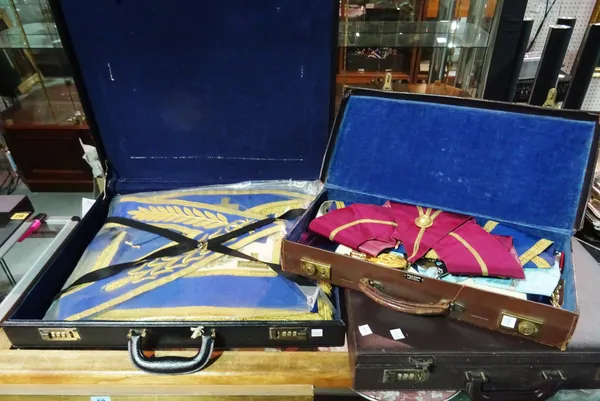 A group of three leather cases containing various Masonic costume and accessories, (3).  CAB