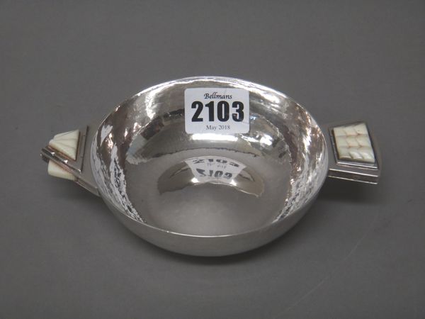 A silver and ivory mounted circular two handled nut dish, with an arrow head and arrow feathers design to the handles, by R.E.Stone, London 1932, gros