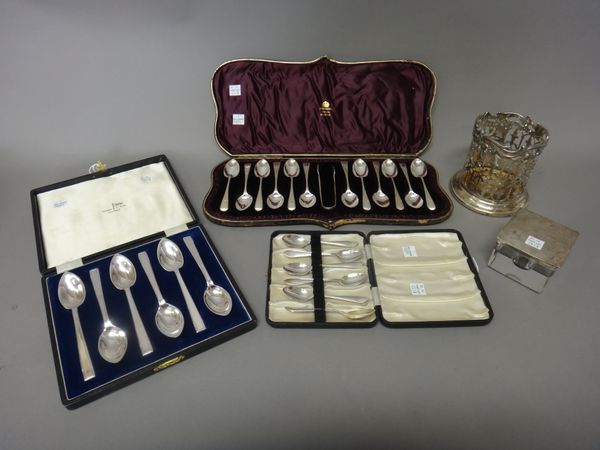 Silver, comprising; a set of twelve Victorian teaspoons and a matching pair of sugar tongs, with engraved bright cut decoration, London 1889, cased, a