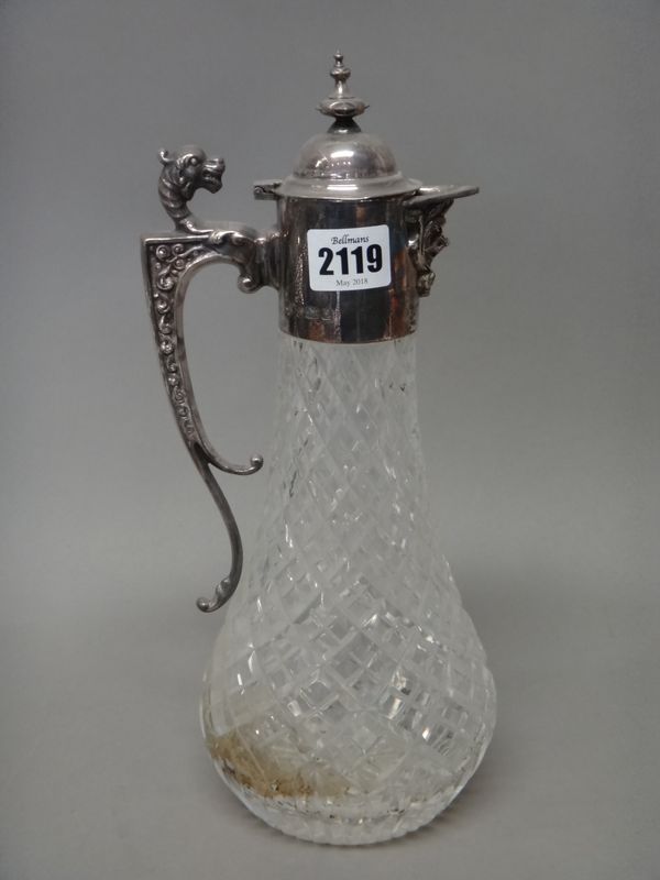 A silver mounted faceted glass claret jug, the angular handle with an animal head finial, modern, height 31cm.