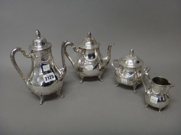 A French four piece tea and coffee set, comprising; a teapot, a coffee pot, a twin handled sugar bowl and cover and a milk jug, each piece of baluster