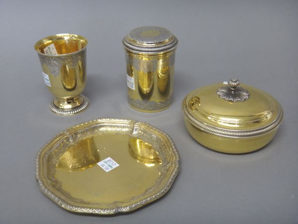 A French parcel gilt goblet, with a decorated band to the rim in the 18th century taste, detailed Christian Dior, Made in France, a French parcel gilt