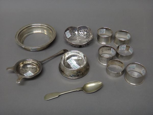 Silver and silver mounted wares, comprising; a quatrefoil shaped bonbon dish, having pierced decoration, Birmingham 1925, a tea strainer, with an asso