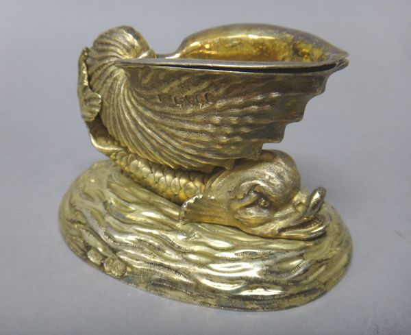 A set of four William IV silver gilt salts, each formed as a mythological fish supporting a large shell, each oval base resembling the sea, numbered 1