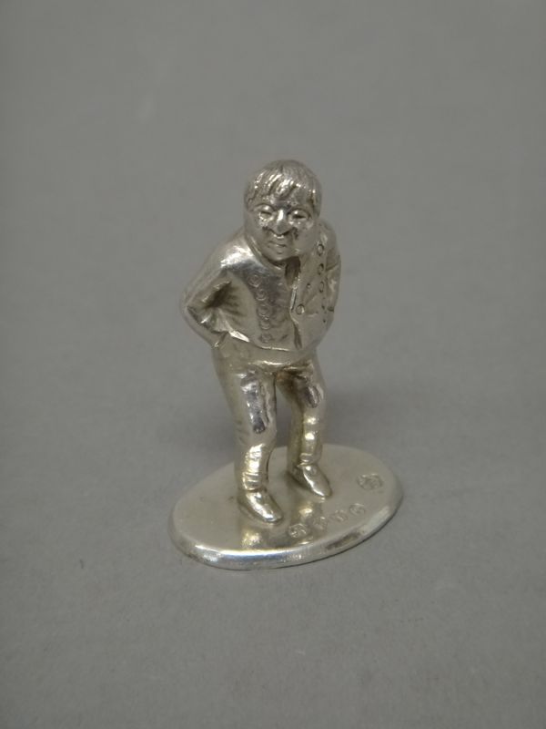 A Victorian novelty cast silver seal, formed as the nursery rhyme character 'Little Tommy Tucker', by Judah Rosenthal & Samuel Jacob, London 1888, 4cm