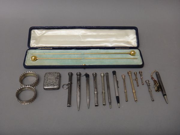 A pair of silver napkin rings, Birmingham 1904, a plated rectangular vesta case, a collection of thirteen various pencils, some having seal finials an