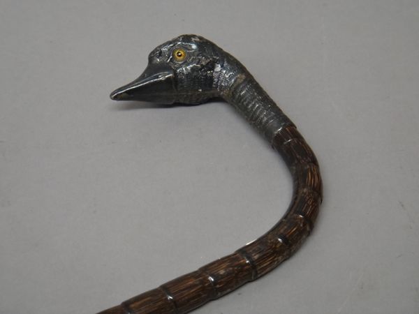 A Victorian novelty silver mounted walking stick, the handle formed as a bird's head, with inset eyes, by Julius Klinkhardt, London 1893, the shaft pr