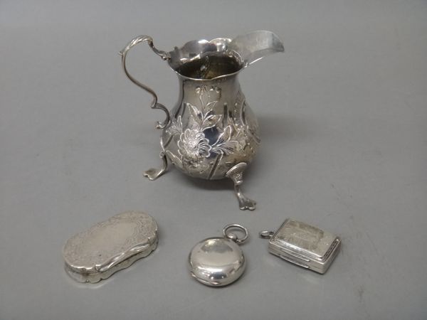 Silver, comprising; a George IV rectangular vinaigrette, the grille engraved and pierced with a cornucopia and floral motif, the exterior lid engraved