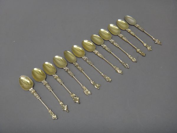 Twelve gilt large Apostle teaspoons, each with cast decoration, having a spiral stem and with a figure terminal, possibly Dutch, (12).