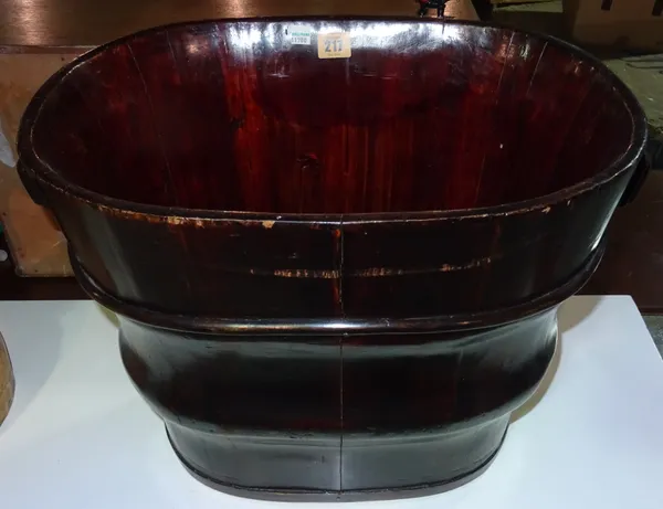A 20th century hardwood bucket of tapering form, 48cm wide x 45cm high.  J2