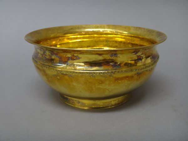 A Russian silver gilt bowl, of circular form, decorated with a foliate fine band, raised on a circular foot, Moscow 1808, diameter 16.5cm, weight 343