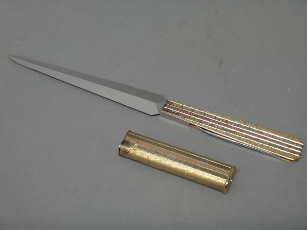 A 9ct three colour gold mounted letter opener cum folding pocket knife, with a bark textured finish, maker's mark R & R, London 1979, length 22cm and