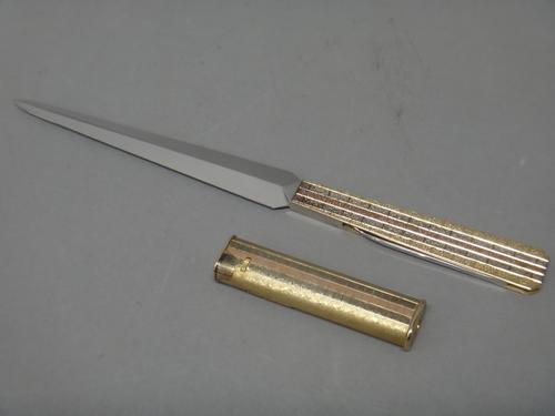 A 9ct three colour gold mounted letter opener cum folding pocket knife, with a bark textured finish, maker's mark R & R, London 1979, length 22cm and